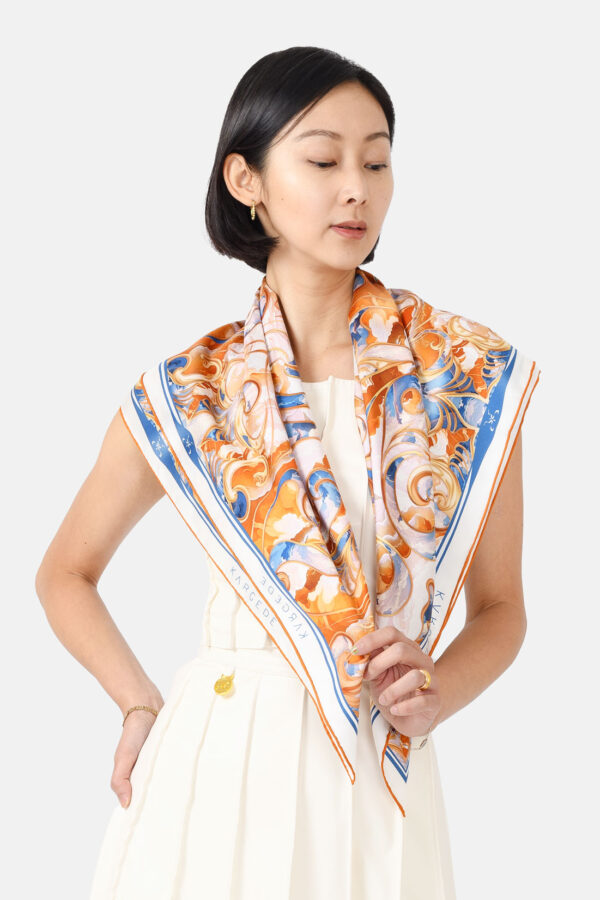 Orange White Blue Silk Scarf Clouds Pattern Kargede Designer Scarf Shoulder Front 2 - Designer Silk Scarf - Blue, White, and Orange Clouds